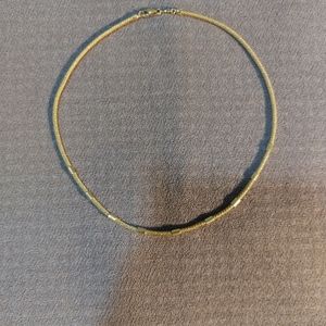 14 CT gold rope necklace with gold band detailing.